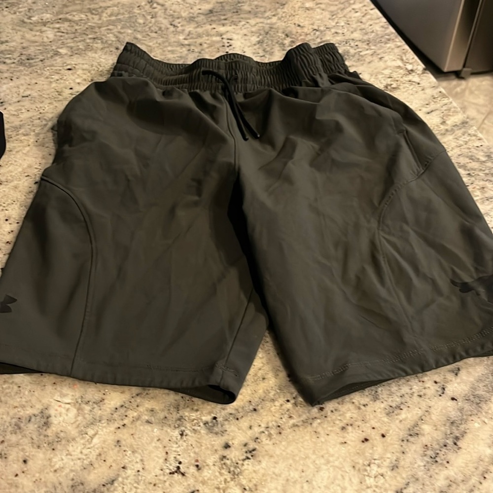 Dark greenish/greyish under Armour rock  L youth shorts.